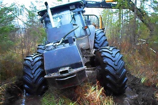 Valtra forestry tractor, difficult road